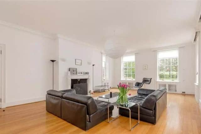 The spacious living room has a feature fireplace.