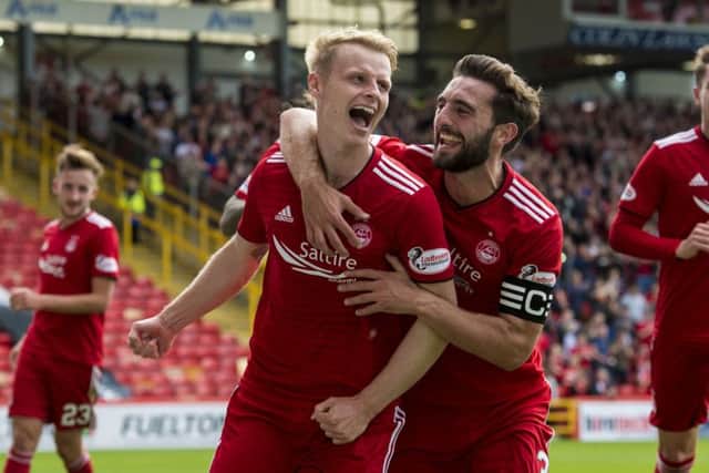Gary Mackay-Steven, celebrating scoring a goal for Aberdeen, hopes he will soon be doing the same at the Yankee Stadium. Picture: SNS.