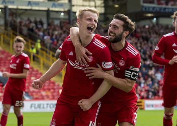Gary Mackay-Steven, celebrating  scoring a goal for Aberdeen, hopes he will soon be doing the same at the Yankee Stadium. Picture: SNS.