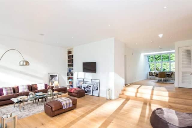 The open plan living room also has a dining area.