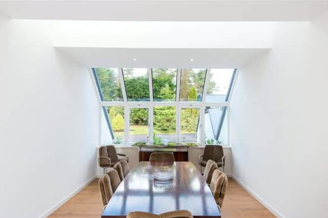 Despite being tucked away, the dining area makes the most of the large windows and views.