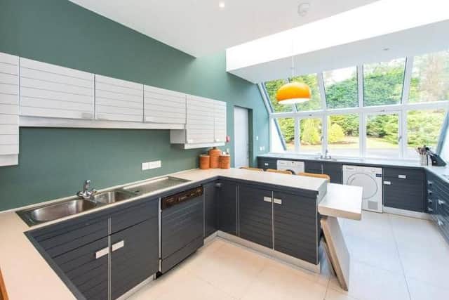 The eye-catching kitchen has plenty of storage space.