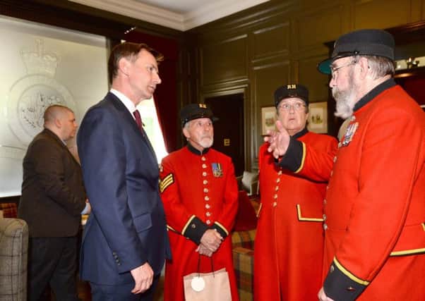 Jeremy Hunt with Chelsea pensioners. Picture: Kirsty O'Connor/PA Wire
