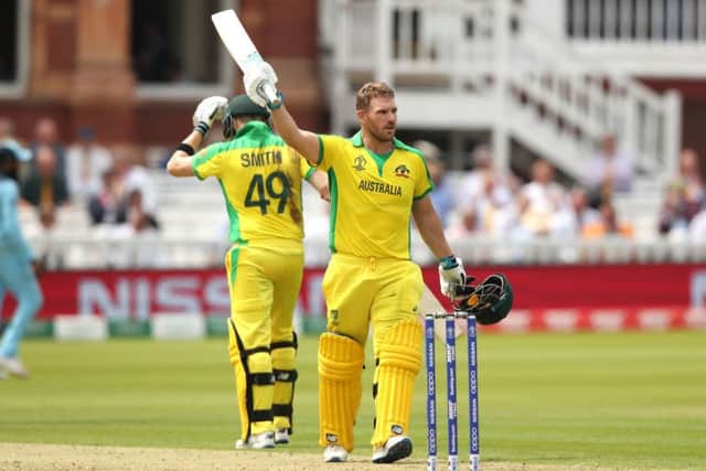 Australia's Aaron Finch celebrates reaching his century. Picture: Tim Goode/PA Wire
