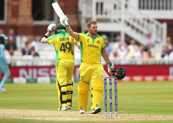 Australia's Aaron Finch celebrates reaching his century. Picture: Tim Goode/PA Wire