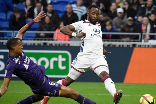 Christopher Jullien challenges former Celtic striker Moussa Dembele during a match between Toulouse and Lyon last season.
