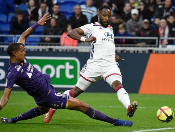 Christopher Jullien challenges former Celtic striker Moussa Dembele during a match between Toulouse and Lyon last season.