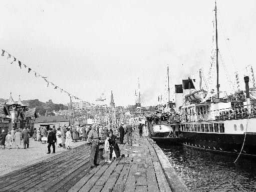 Holiday makers and day trippers arrive 'doon the watter' by steamer at Rothesay Pier in July 1959. Picture: JPIMedia