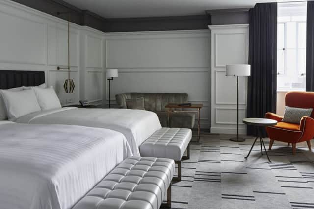 One of the bedrooms in this five star hotel that has an art deco feel that complements the building's rich history