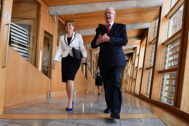 Nicola Sturgeon and constitutional affairs spokesman Mike Russell ahead of a statement on a possible future referendum