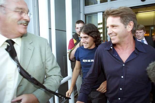 Diego Maradona Jnr, centre, and agent Luciano Marangona are greeted by Dunfermline director of football Jim Leishman at Edinburgh Airport in 2004. Picture: SNS