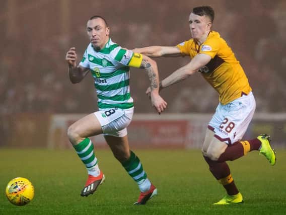 David Turnbull, right, vies for possession with Scott Brown during a 1-1 draw at Fir Park last season.