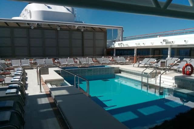 The roof is retracted to create an open-air pool. Picture: Alastair Dalton