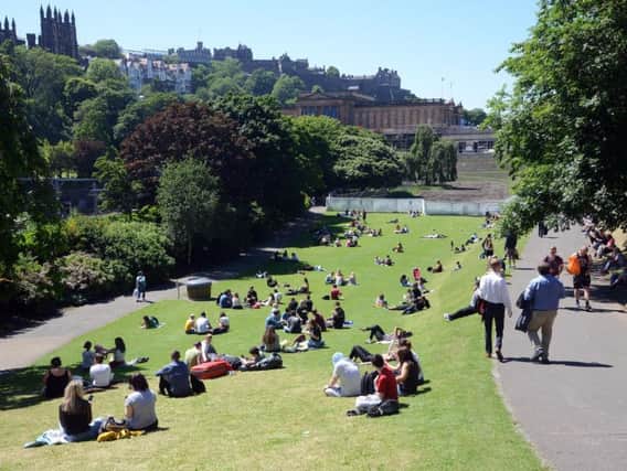 A short hot spell will see the mercury climb across the country. On Thursday Edinburgh residents basked in the sunshine in Princes Strett Gardens (pictured) Picture: TSPL