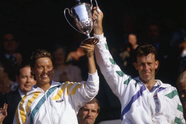 Jo Durie and Jeremy Bates celebrate after winning the mixed doubles final at Wimbledon in July 1987. Picture: Russell Cheyne/Getty Images