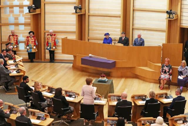 Queen Elizabeth II and the Duke of Rothesay listen as First Minister Nicola Sturgeon makes a speech during a ceremony marking the 20th anniversary of devolution in the Holyrood chamber at the Scottish Parliament in Edinburgh. Picture: Andrew Milligan/PA Wire