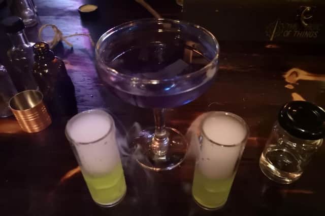 Guests follow instructions to brew two of molecular potions that change colour, bubble, and smoke