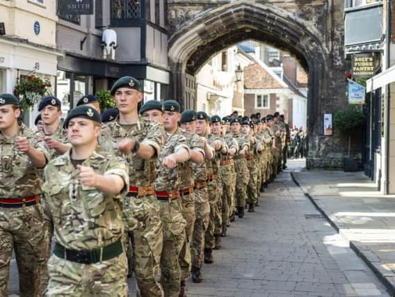 Armed Forces Day was celebrated across the UK. Pictured here troops march through Salisbury in England. Picture: PA