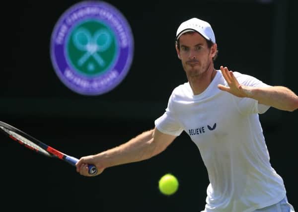Andy Murray, on the practice courts at the All England Club, will team up with Pierre-Hugues Herbert in the mens doubles. Picture: PA.