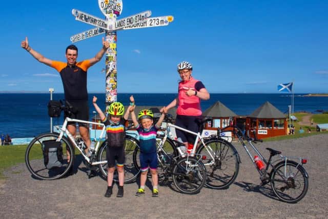 The Jones family complete their Land's End to John O'Groats cyle. Pic: Tom Jones/@FamilyByCycle