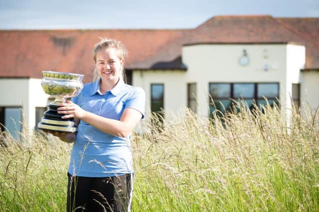 Kimberley Beveridge shows off the Scottish Womens Championship trophy after her win over Chloe Goabdy (St Regulus) in the 18-hole final at Kilmarnock (Barassie)