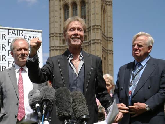 Sir Cliff Richard flanked by Daniel Janner (left) and Michael Grade (right).