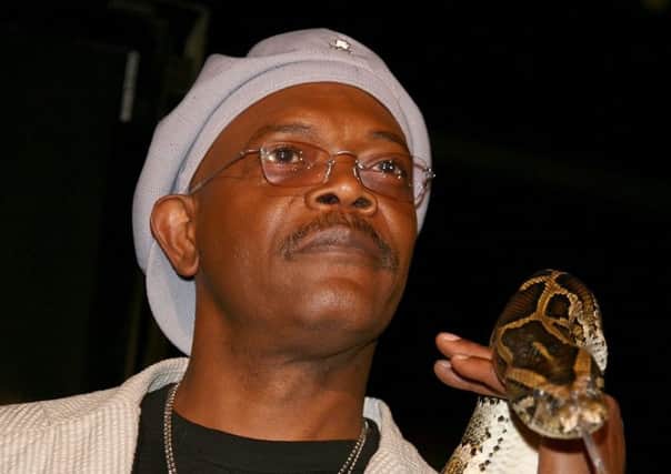 A possible climate emergency measure? Samuel L Jackson holds a snake ahead of the premiere of the film Snakes On A Plane. Picture: Kevin Winter/Getty Images