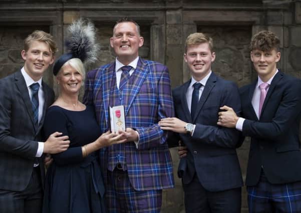 Former Scotland rugby international and motor neurone disease campaigner Doddie Weir, with wife Kathy and their three sons (from left) Hamish, Ben and Angus, after receiving his OBE from Queen Elizabeth (Picture: Jane Barlow/PA Wire)