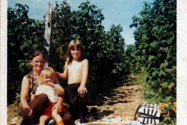 It was often a family affair in the berry fields with parents and their young often travelling to  Fife, Angus and Perthshire from the Central Belt for the chance of summer work. PIC: One Voice Photo Collection, Blairgowrie