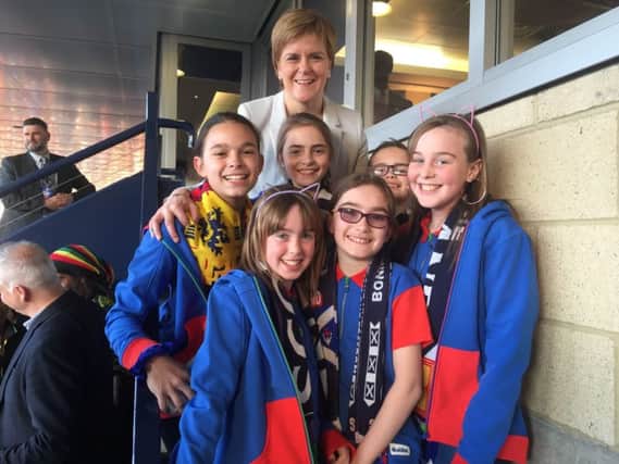 Torrance, Caitlin and Beth from the 6th Blantyre Guides at Hampden watching Scotlands Womens Football Team in action