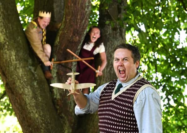Adam Donaldson, Ben Noble and Natalie Lauren dressed as Enid Blyton-style schoolchildren in Henry V. Picture: John Devlin