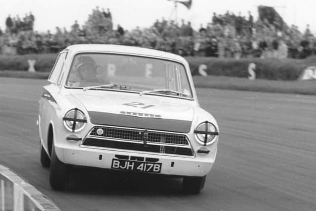 Jim Clark at the wheel of the Lotus Cortina which he raced to victory in the 1964 British Saloon Car Championship. PIC: Contributed.