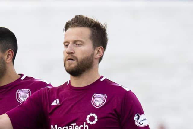 Two goals by Steven Doris helped Arbroath to defeat Hibs. Picture: SNS.