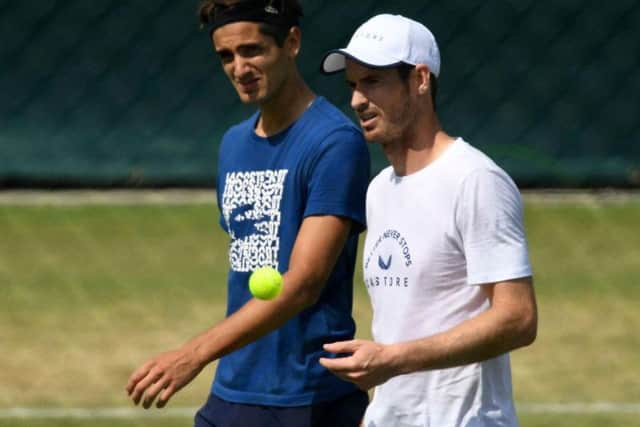 Andy Murray with men's doubles partner Pierre-Hugues Herbert