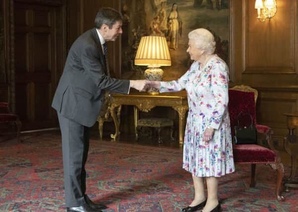 Queen Elizabeth meets Holyroods presiding officer Ken Macintosh amid its 20th anniversary celebrations (Picture: Getty)