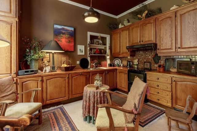 The traditional style kitchen has space for dining.