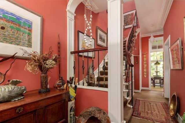 The hallway also has ceiling cornicing.