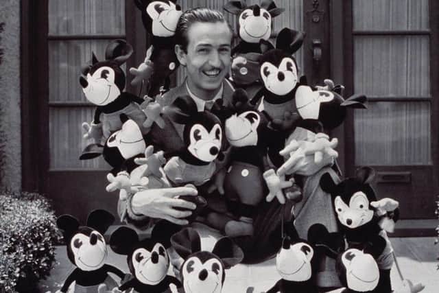 Walt Disney weith an armful of Mickey Mouse dolls. Picture: HO/AFP/Getty Images