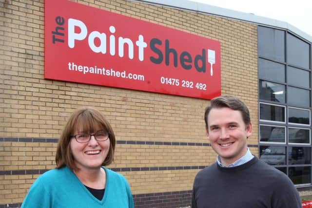 Michael Rolland and a team member from The Paint Shed's Greenock store. Picture: Newsquest Media