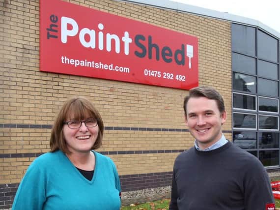 Michael Rolland and a team member from The Paint Shed's Greenock store. Picture: Newsquest Media