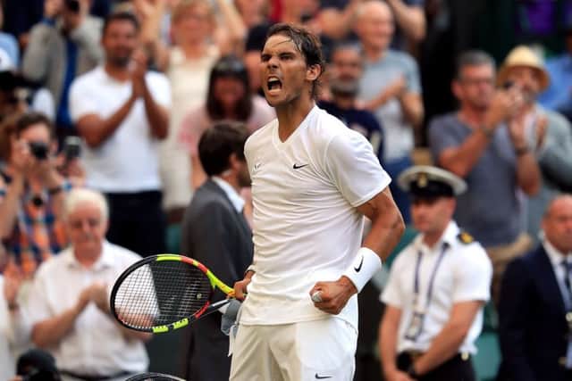 Rafael Nadal roars in celebration after defeating Nick Kyrgios 6-3, 3-6, 7-6 (5), 7-6 (3) on Centre  Court. Picture: PA