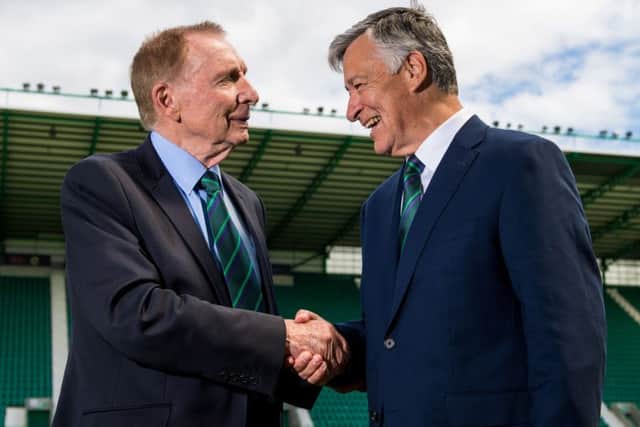 New Hibs chairman Ron Gordon shakes hands with Sir Tom Farmer. Picture: SNS
