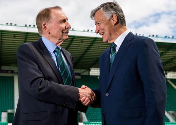 New Hibs chairman Ron Gordon shakes hands with Sir Tom Farmer. Picture: SNS