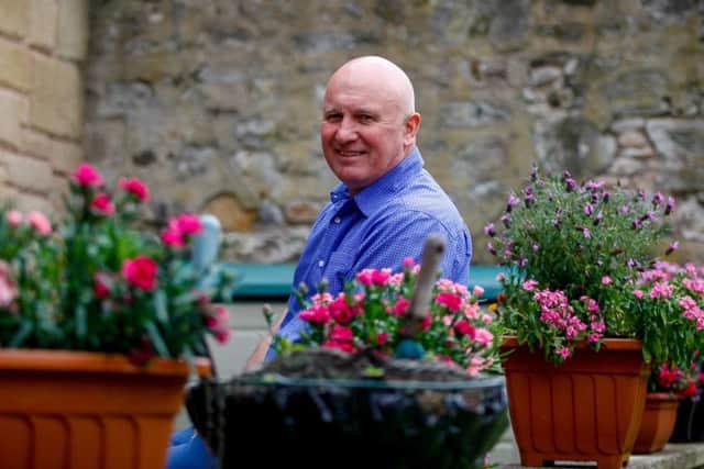 Eamonn Bannon in the garden of his guesthouse. Picture: Scott Louden