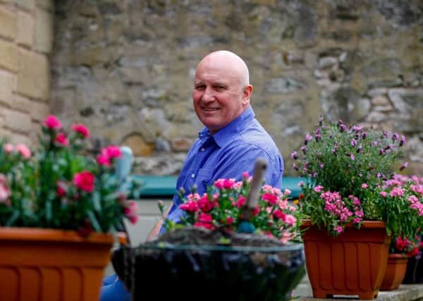 Eamonn Bannon in the garden of his guesthouse. Picture: Scott Louden