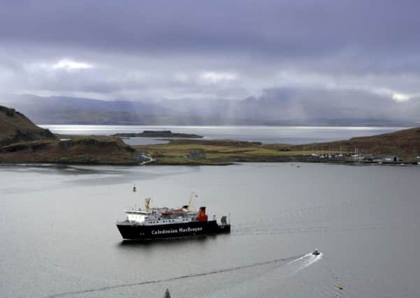A Caledonian MacBrayne ferry slips in past Kerrera, with Mull in the misty background (Picture: Donald MacLeod)