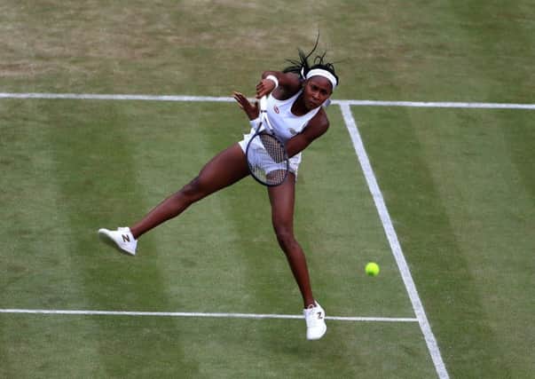 Cori Gauffplays a smash during her win over Polona Hercog. Picture: Mike Egerton/PA Wire