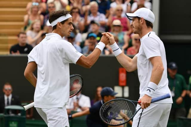 Andy Murray, right, and doubles partner Pierre-Hugues Herbert. Picture: Daniel Leal-Olivas/AFP