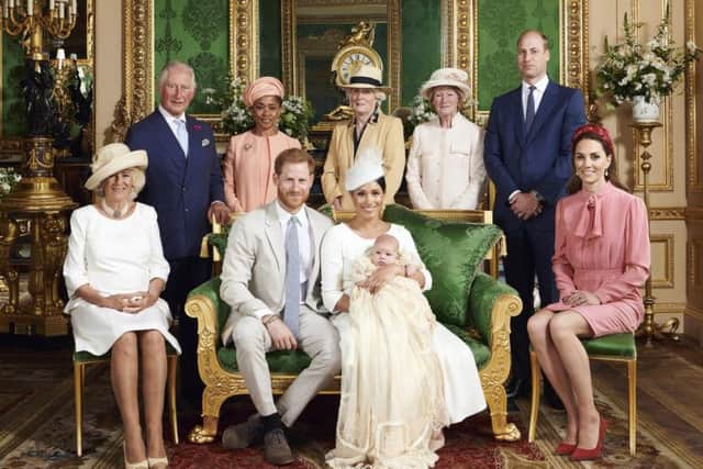 This official christening photograph released by the Duke and Duchess of Sussex shows the Duke and Duchess with their son, Archie and (left to right) the Duchess of Cornwall, The Prince of Wales, Ms Doria Ragland, Lady Jane Fellowes, Lady Sarah McCorquodale, The Duke of Cambridge and The Duchess of Cambridge in the Green Drawing Room at Windsor Castle. Picture: Chris Allerton/SussexRoyal