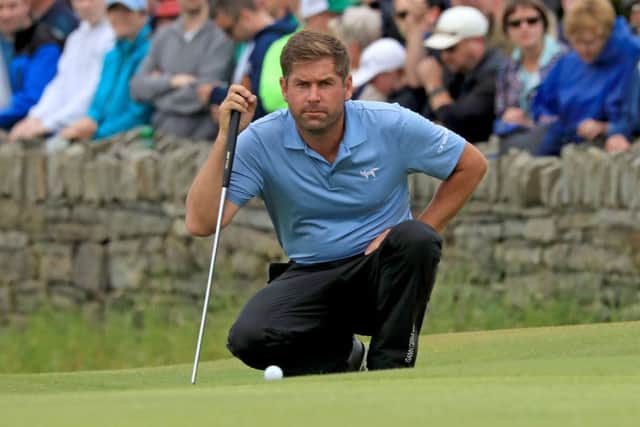 Robert Rock lines up his putt for a round of 59 in the Irish Open. Picture: Donall Farmer/PA Wire